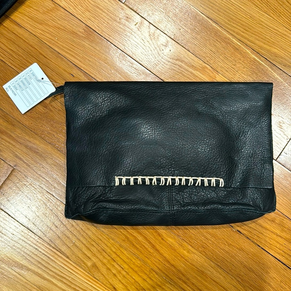 Black soft leather Anthropologie clutch. Never been used. Tags still on.